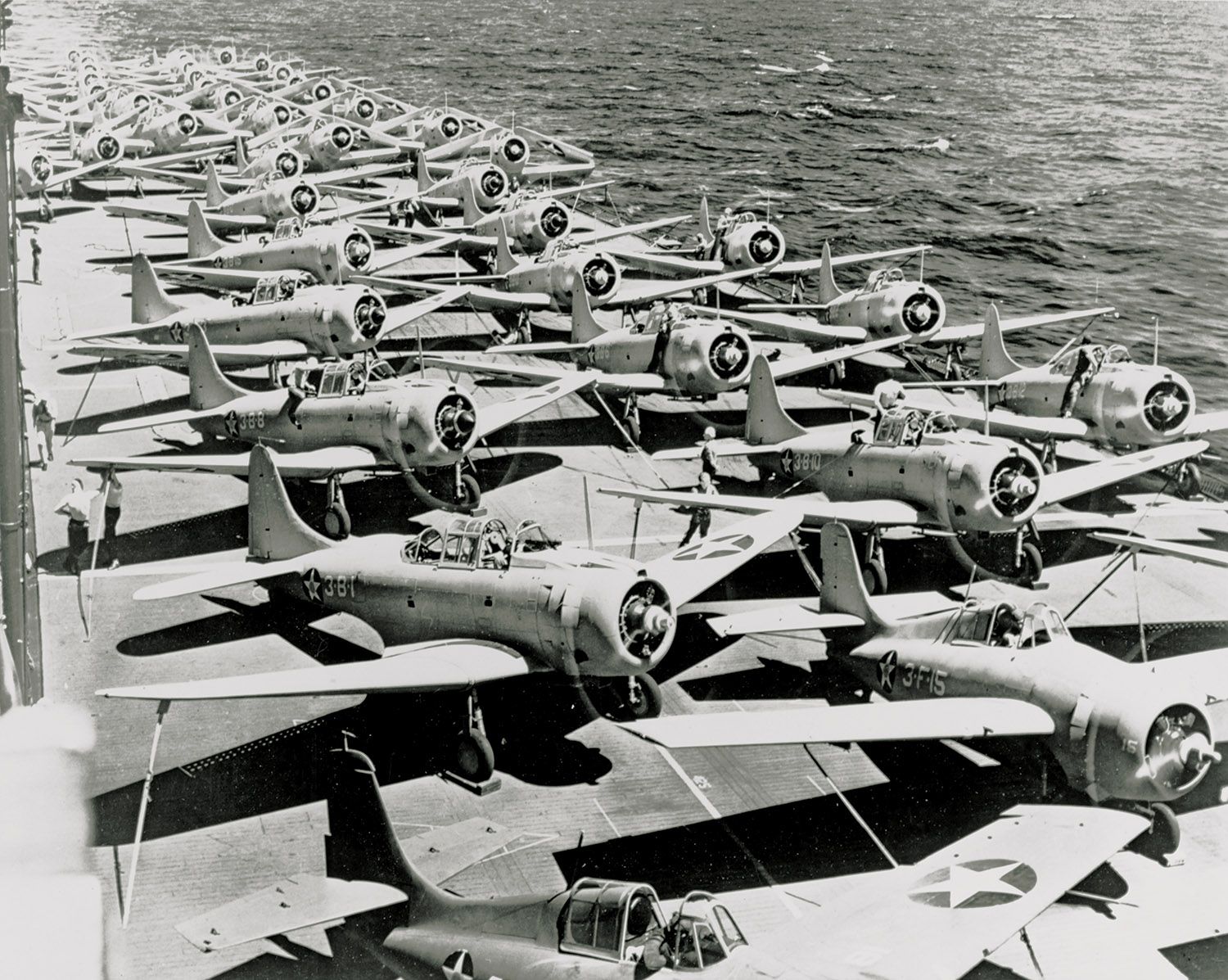 USS Saratoga flight deck circa fall 1941 with Grumman F4F-3 aircraft in the foreground and Douglas SBD-3 Dauntless and TBD-1 Devastator aircraft parked further back. USS Saratoga flight deck circa fall 1941 with Grumman F4F-3 aircraft in the foreground and Douglas SBD-3 Dauntless and TBD-1 Devastator aircraft parked further back.